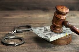 Gavel, money, and handcuffs